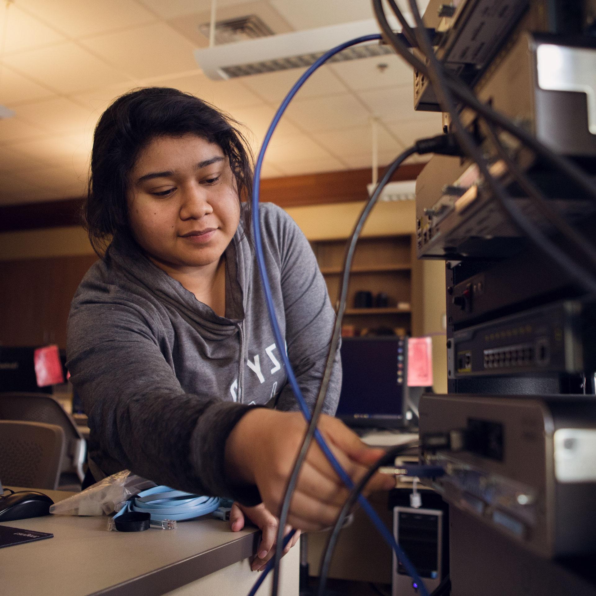 CIS student working on a server